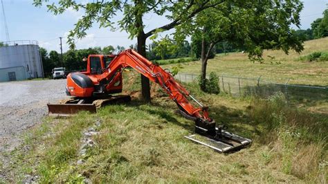 using a brush cutter on mini excavator|spartan mini excavator brush cutter.